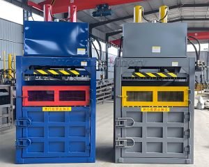 How does the vertical hydraulic baler work